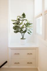 House plants, built-in shelving, and modern touches are found throughout the home.