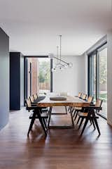Dining Room, Table, Dark Hardwood Floor, Ceiling Lighting, Lamps, and Chair  Photo 8 of 17 in CG House Madrid by Lourdes Martínez Nieto Arquitectura y Diseño