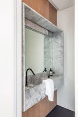 Bath Room, Quartzite Counter, Porcelain Tile Floor, Wall Mount Sink, Ceramic Tile Wall, and Wall Lighting  Photo 12 of 17 in CG House Madrid by Lourdes Martínez Nieto Arquitectura y Diseño