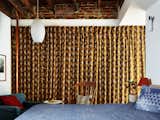 Jeffrey tracked down this Miss Matatabi Japanese fabric that was made into curtains in the primary bedroom. "It hides all sorts of imperfections in the wall, and adds a lot of visual interest," he says.