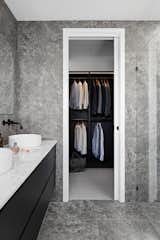 There is plenty of storage in our home - including the walk through robe in the Master. It has a moody, sophisticated feel with all black cabinetry.