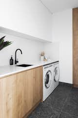 The stand-alone laundry is hidden behind a sliding door off the hallway.
