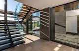 Another common detail found in McClean’s homes is a water feature. This home has a water wall that feeds to the court below, which splits the basement into two parts.