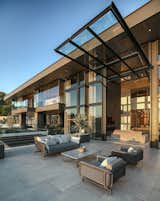 Paul McClean is known for seamlessly blurring the lines between the interiors and exteriors of the homes he designs, and this home is no exception. The interior and exterior decks become an uninterrupted living space through use of the glass walls.