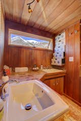 Bath Room, Ceramic Tile Floor, Freestanding Tub, Drop In Sink, Ceiling Lighting, One Piece Toilet, and Concrete Counter Views of Mt. Elbert - Colorado's highest peak  Photo 9 of 16 in Alpine Haven, Twin Lakes, Colorado. by Bert Rankin