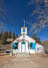 Outdoor, Trees, Grass, Landscape Lighting, and Front Yard Historic school house behind cabin  Photo 16 of 16 in Alpine Haven, Twin Lakes, Colorado. by Bert Rankin