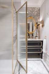 Playing on the Georgian design, a beautify bespoke marble floor is further dressed with a chest becomes vanity unit.
