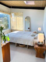 Bedroom #1 with custom Donald Judd inspired bedframe. Vintage mid century side tables and ceramic lamps. Linen sheets. 