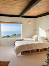 Bedroom #2 with custom Donald Judd inspired bedframe. Schoolhouse Electric fixures above bed and vintage wall light. 