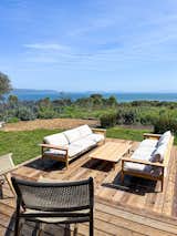 Spacious decsk with unobstructed views of the San Francisco Bay. Large DWR teak/sunbrella sofas. Woven charis by Hati-Hati