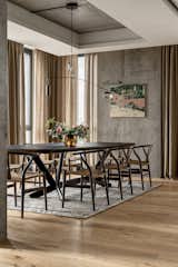 Dining area. Chandelier, Ocher; table, Cattelan Italia; chairs, Carl Hansen; carpet, Gan Rugs.