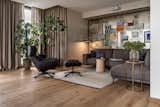 Sofa area. Armchair, Roche Bobois; sofa, Ditre; stump table, Poliform; floor lamp, Bert Frank; aged mirrors behind the sofa, Nordwood (Ukraine); carpet, Gan Rugs.