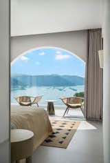 Bedroom, Bed, Night Stands, and Chair  Photo 16 of 19 in Miyue · Blue & White Cliffside Resort by DW