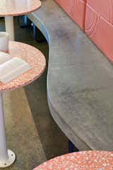 Custom-designed, custom concrete fixed benches ensure maximized seating.