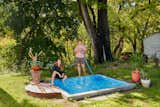 Abigail Lloyd & Bell Kauffman stand next to their plunge pool