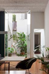 Architect Hernán Landolfo combined two 1950s units on a sun-dappled street in Buenos Aires to create a home for himself, his partner, Lucía Gentile, their daughter, Luisa, and the family dog, Roca.