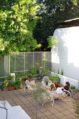 The front terrace is furnished with a set of vintage steel chairs. “Their design is classic for Argentinean garden furniture from the ’60s and ’70s,” says Hernán.