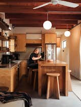 When Molly moved in, the kitchen already had cabinets, made of shamel ash from Angel City Lumber and topped with counters in terrazzo that Responsive Homes made using sediment from the Los Angeles River. She added an island to create “some separation of space,” she says, as well as open shelving.