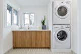 Laundry Room, Wood Cabinet, Engineered Quartz Counter, and Stacked  Photo 10 of 12 in Project Pleasantview by Hayley Lattimore