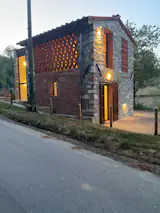Hay Barn at dusk with modern addition peeking out from behind