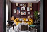 It was in this guest room that Insignio decided to hang and play with the family paintings that had been gathered together over the years. A priceless cross-stitched artworks hangs right in the middle, a rural landscape that sewed for 8 years. The color palette of the cross-stitch artworks is the originator of the color idea of the room, this artworks should stand out the most from other paintings because of its historical value. There is a touch of golden yellow from the massive sofa in the middle of the room, adding to the dramatic impression. The living room looks more elegant with the placement of a black piano, making this place warmer to welcome every guest who comes.