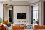 The TV cabinet system design by Insignio Studio hides the storage, focusing on the concept of the “entirely full”, while giving life to the whole walls equipped to perfectly integrate with the surrounding architecture. At the center under the TV, perfectly hidden, sits an active speaker. 