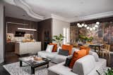 The shape of the modular sofa with movable backrest facilitates the sitting position so that it is more fluid when talking with guest. The choice of jet black flooring colors further strengthens the elegant play of color.