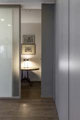 Office, Desk, Study Room Type, and Dark Hardwood Floor Studio  Photo 5 of 11 in Magenta Apartment by Quarta & Armando