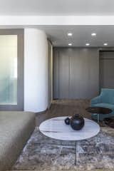Living Room, Sofa, Dark Hardwood Floor, Coffee Tables, and Ceiling Lighting Studio and Entrance  Photo 4 of 11 in Magenta Apartment by Quarta & Armando