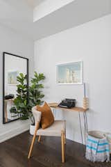 Office, Study Room Type, Desk, Chair, and Medium Hardwood Floor Nook/den where the staging features a dinosaur print  Photo 6 of 9 in Toronto flat with landmark views of the Royal Ontario Museum by meetmiranda