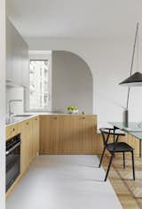 Kitchen, Laminate Counter, Wall Lighting, Wood Cabinet, Light Hardwood Floor, and Vinyl Floor  Photo 15 of 15 in Fitted Lines by Atelierzero