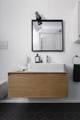 Bath Room, Ceramic Tile Floor, Wall Lighting, Wood Counter, and Two Piece Toilet  Photo 15 of 15 in Volumes by Atelierzero