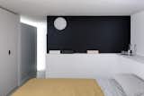 Bedroom, Storage, Bed, Linoleum Floor, Wardrobe, and Wall Lighting  Photo 12 of 15 in Volumes by Atelierzero