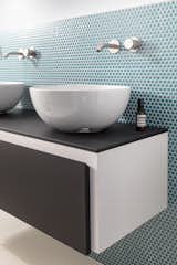 Bath Room, Laminate Counter, Mosaic Tile Wall, Two Piece Toilet, and Linoleum Floor  Photo 13 of 15 in Volumes by Atelierzero