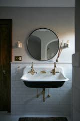 A double utility sink replaced a single pedestal sink