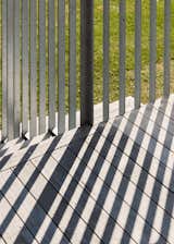 Galvanised steel balustrades casting striking shadows in the afternoon sun