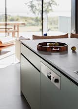 A neutral palette with moments of unexpected colour to the kitchen joinery  Photo 15 of 29 in A Family’s Seaside Cottage Renovation Makes Room for New Memories from The Marlo Summer House