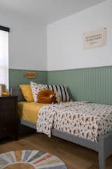 Kids bedroom with green accent paneling