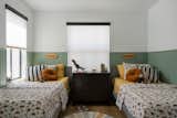 Kids bedroom with green accent paneling