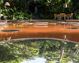 The bam'bo͞o bar 箂 at Casacor Rio 2022 - The mirrors floating on the pool - Maritza Caneca artwork