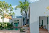 Outdoor, Shrubs, Pavers Patio, Porch, Deck, Landscape Lighting, Stone Fences, Wall, Large Patio, Porch, Deck, Swimming Pools, Tubs, Shower, Concrete Pools, Tubs, Shower, Trees, Concrete Fences, Wall, Small Pools, Tubs, Shower, and Back Yard Terrace and pool area  Photo 20 of 29 in La Posmoderna by FMT estudio