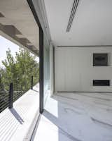 Bedroom, Wardrobe, Marble Floor, Storage, and Ceiling Lighting Balcony of master bedroom  Photo 18 of 28 in Inner Garden Villa by C van Ling