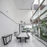 Dining Room, Marble Floor, Table, Ceiling Lighting, Chair, and Lamps Dining area  Photo 13 of 28 in Inner Garden Villa by C van Ling