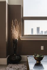 The NYC skyline provides a perfect view from the living room while the modern ceramics add a touch of luxury.