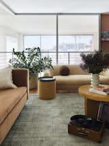 A place where grown up yet playful, creative energy hums.  Sofa and ottoman/side table from Blu Dot.