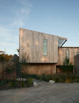 The design takes cues from a rich lineage of singular, honest and robust timber coastal houses on the Mornington Peninsula, while adapting its form and site strategy to the more layered needs of its prominent position on sloping land in an evolving town.