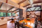 Plank and beam vaulted ceiling, custom MCM cabinetry and heated slate floor