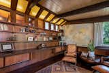 Music room/den with original paneling & shelving, complete with vintage map!