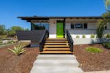 The front door color was uncovered under layers of paint and matched in 2022.