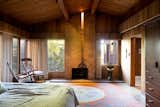 Primary Bedroom -- fireplace by sculptor James Hubbell and ceramist Rhoda Lopez